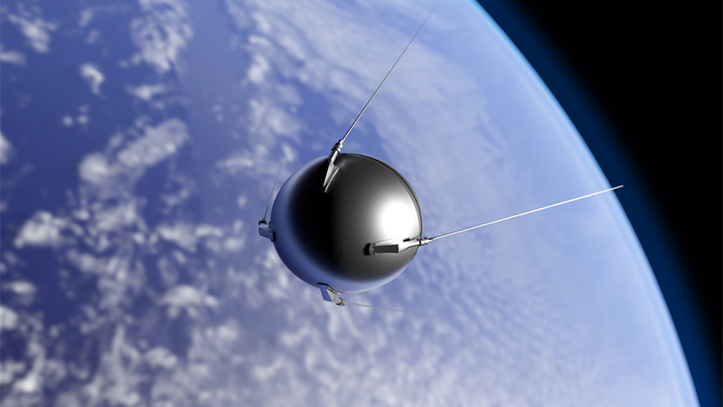 An illustration of the first artificial satellite "Sputnik" launched by the Soviet Union in 1957 orbiting the Earth