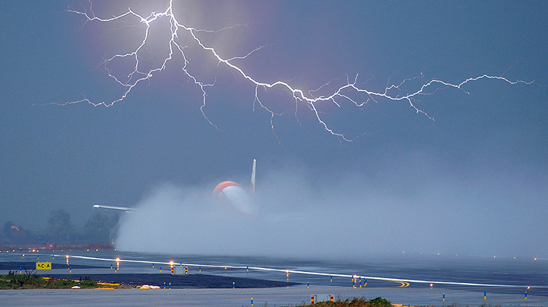 Plane taking off in lightning
