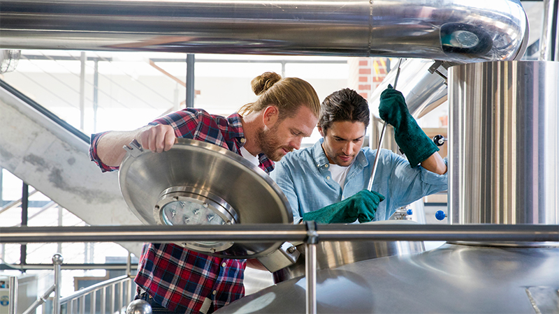 Brewery Workers Checking Fermentation Process