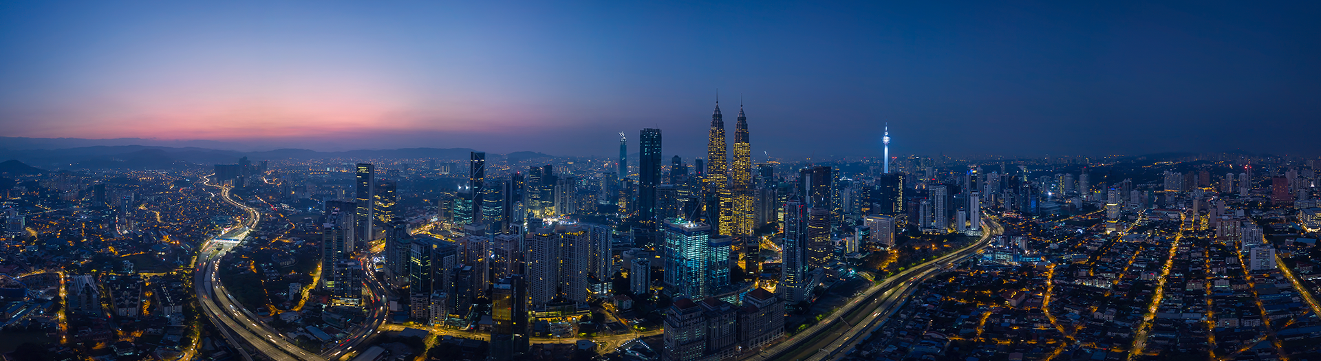 Panorama aerial view in the middle of Kuala Lumpur cityscape skyline .Night scene before sunrise , Malaysia 