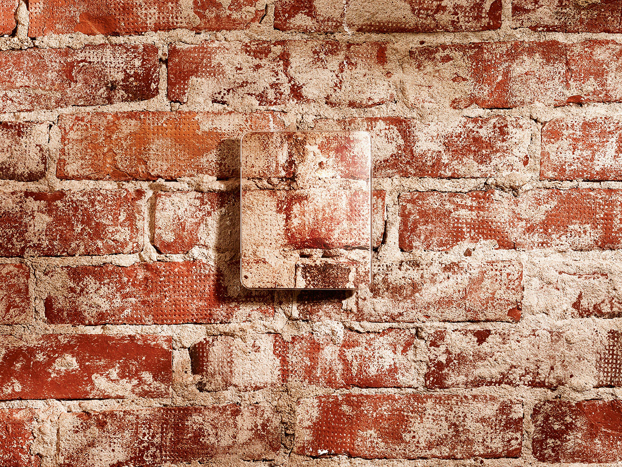 Example of a decorative cover for GMW90 and HMW90 on a brick wall