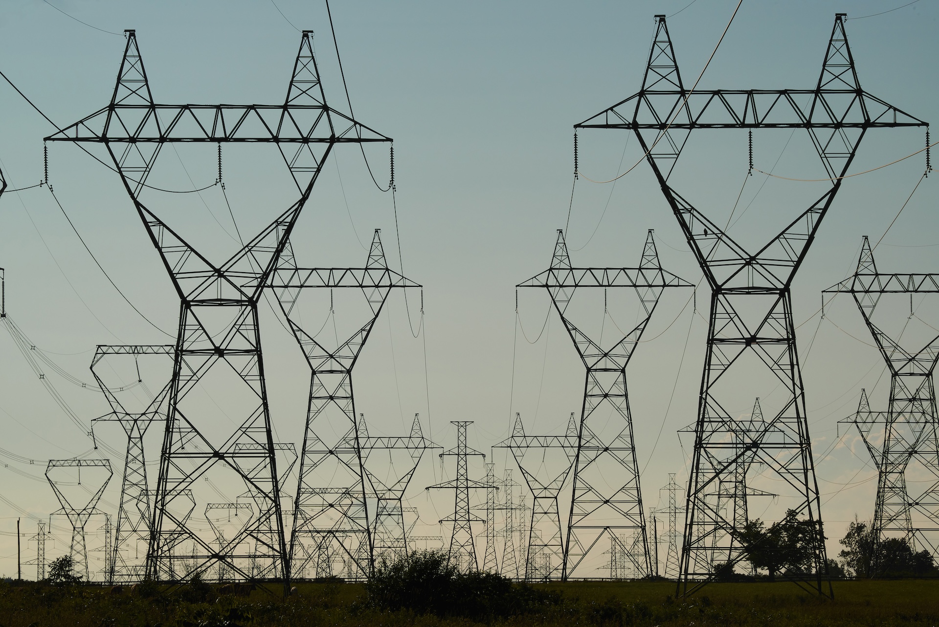Power Grid Towers and Power Lines against a dusk sky