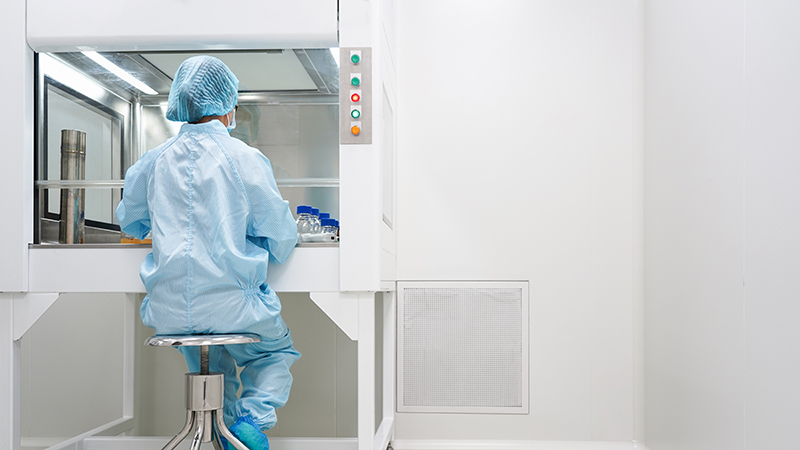 Laboratory worker in cleanroom.