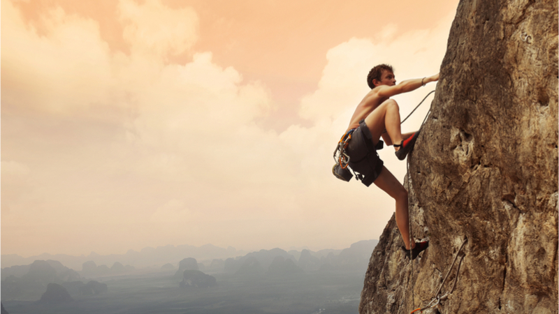 A man climbing a mountain