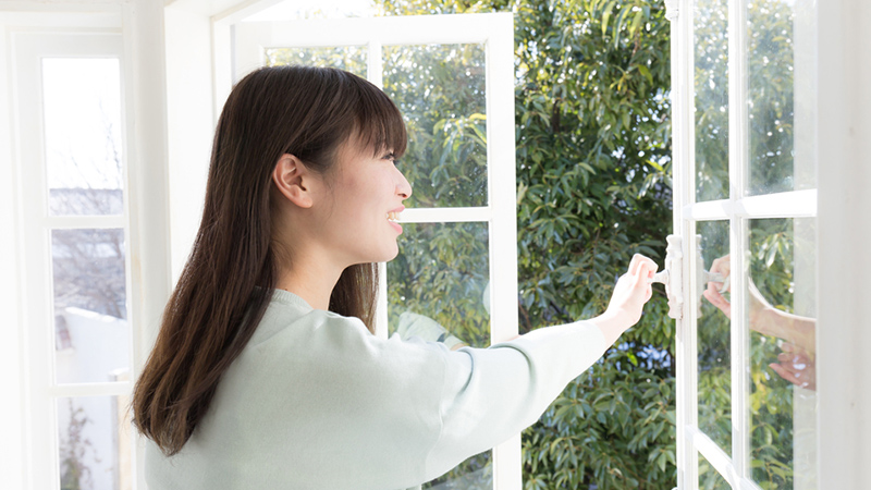 Woman opening a door