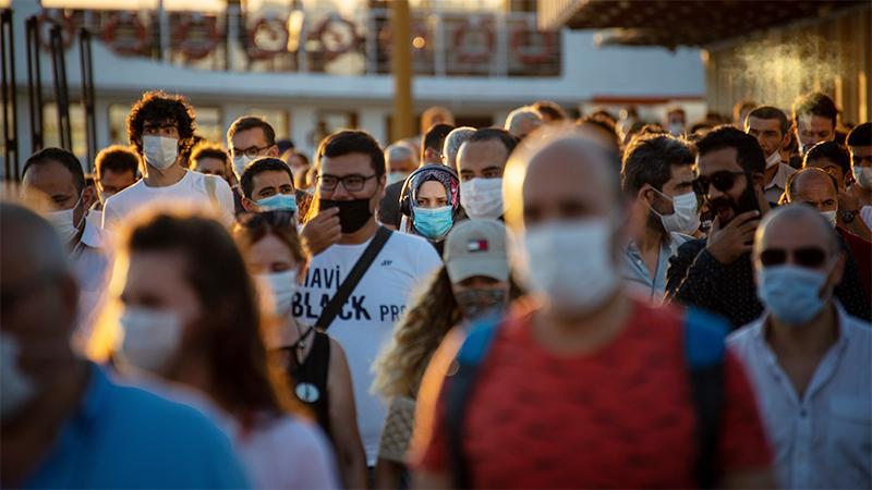 People wearing masks on a street
