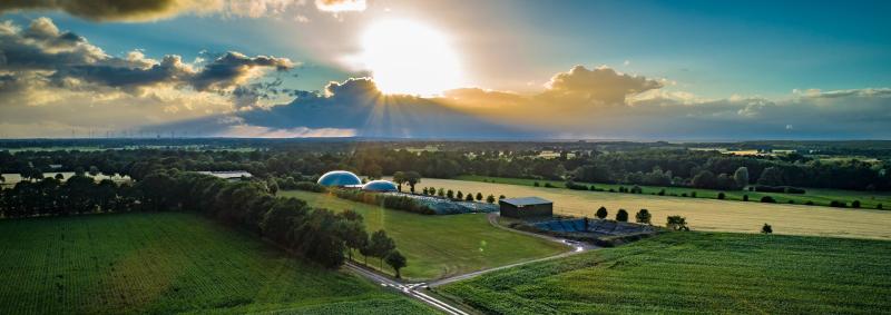 Biogas plant in countryside landscape