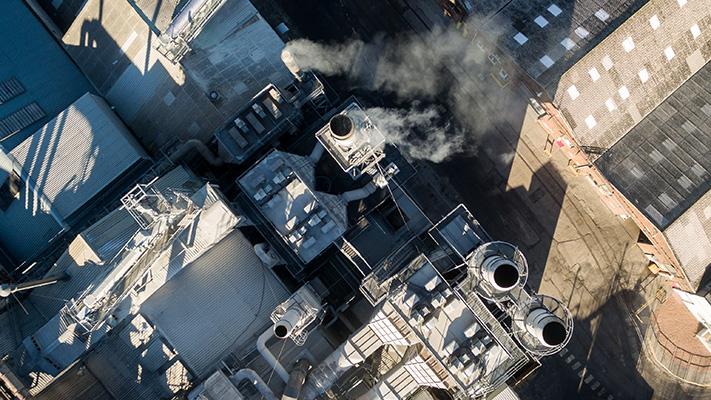 A large scale industrial complex and factories viewed from above
