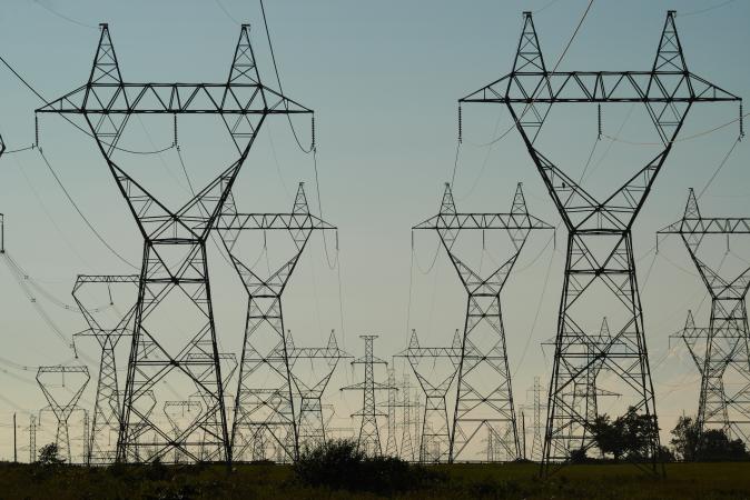 Power Grid Towers and Power Lines against a dusk sky