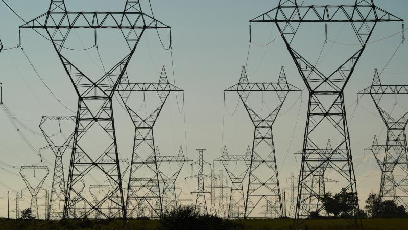 Power Grid Towers and Power Lines against a dusk sky