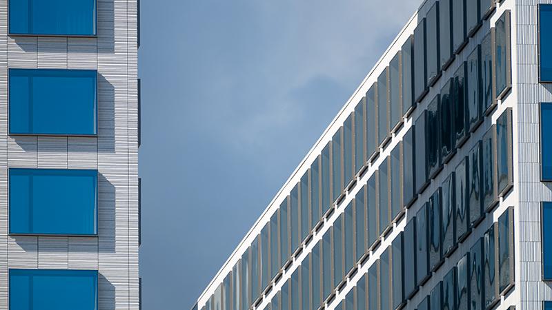 Two modern buildings with blue glass, Helsinki