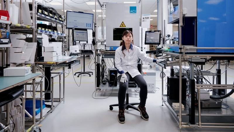 Employee in a production cell at Vaisala Instrument Factory
