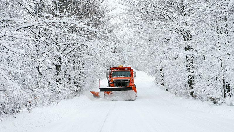 Snowplow clearing road