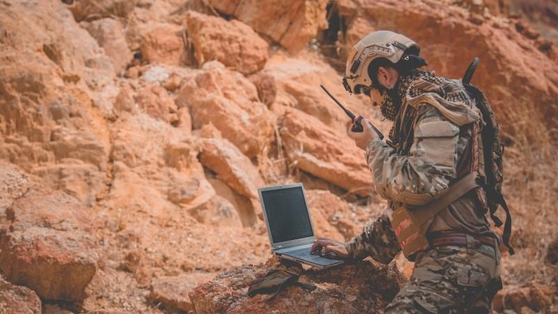 Soldier working on laptop