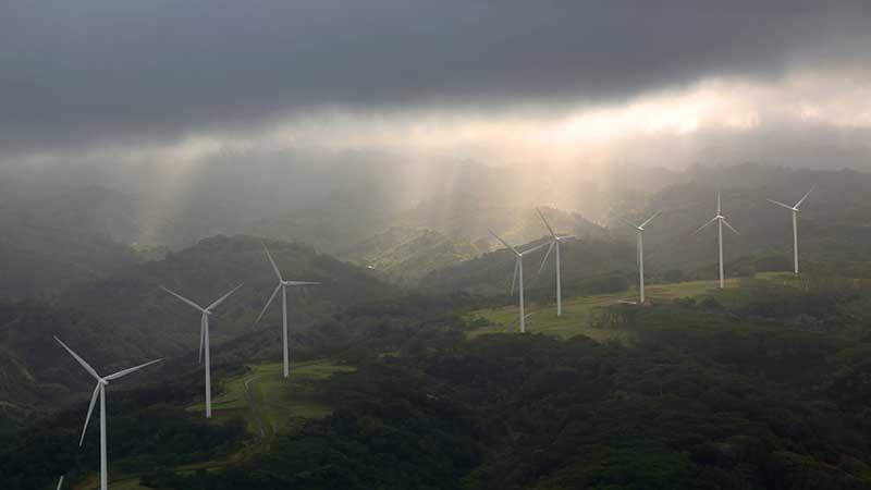 Sunbreak at wind turbines after storm