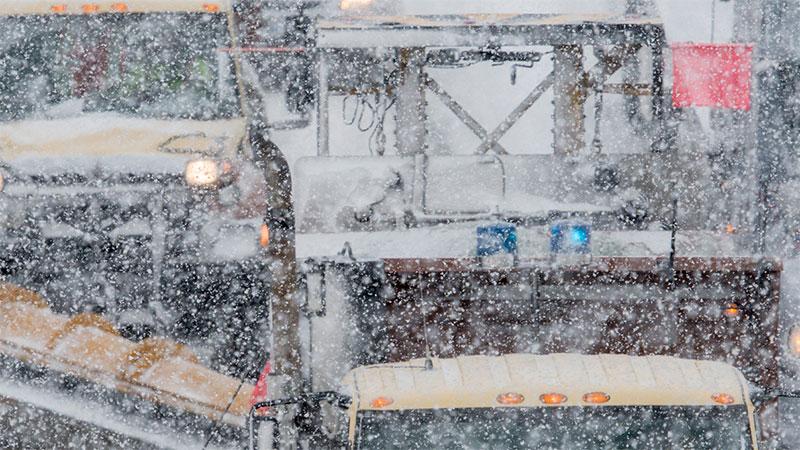 Snowplows in blizzard