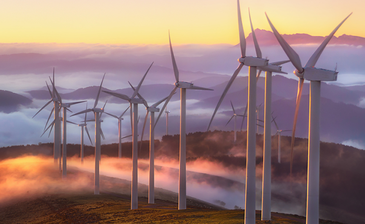 Wind turbines on a hill on a misty morning