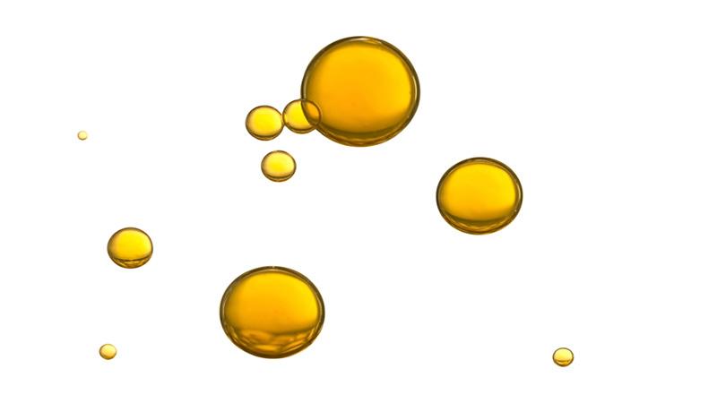 Oil drops on white surface