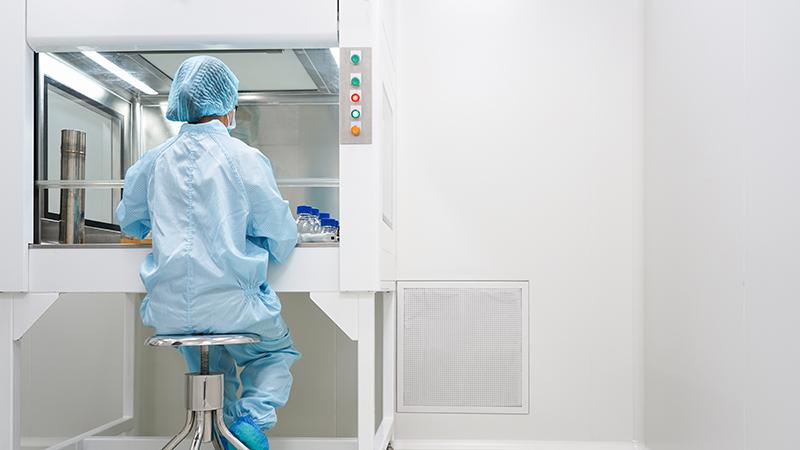 Laboratory worker in cleanroom.