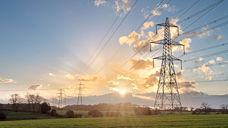 Power lines in a sunrise.
