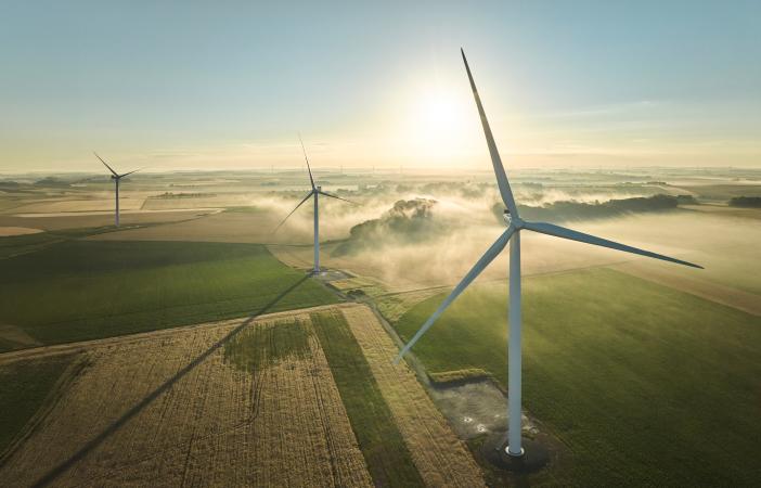 Aerial view of wind turbines in a field