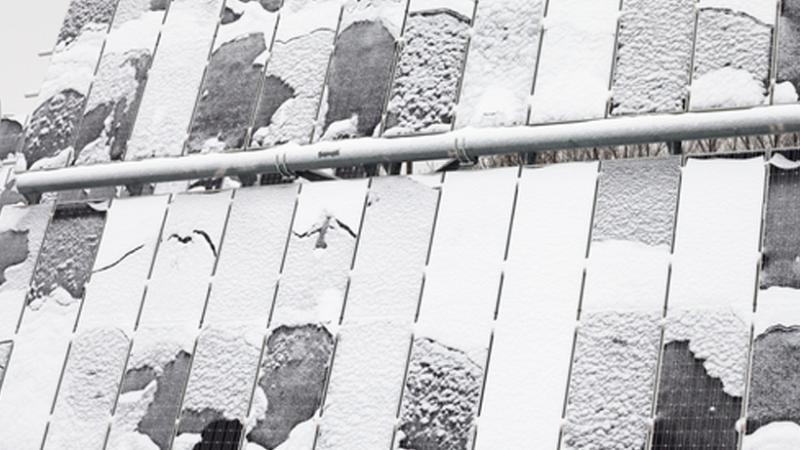 Solar panels with snow and ice