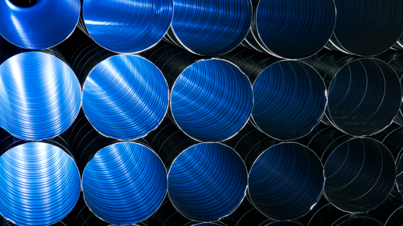 HVAC pipe ducting illuminated by blue light