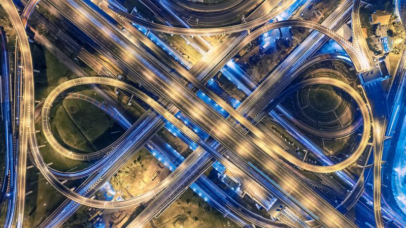 A city highway crossing at night