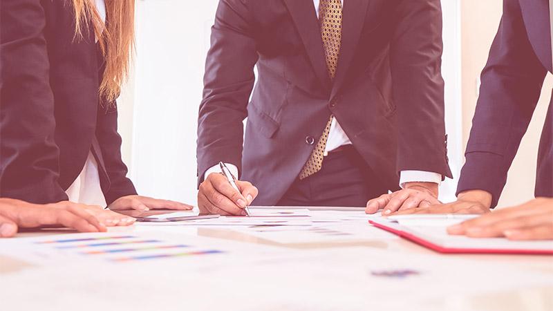 Leaning on meeting table
