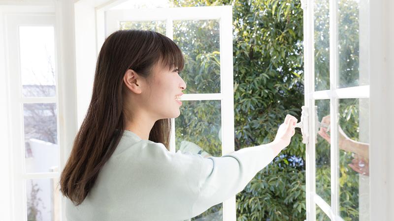 Woman opening a door