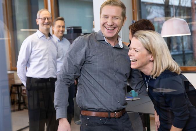 a group of people laughing together.