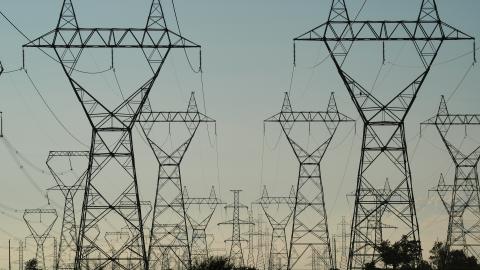 Power Grid Towers and Power Lines against a dusk sky