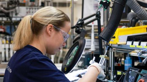 Woman working with lifecycle services technology