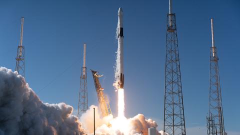 Rocket launch liftoff close up on launchpad.