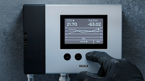 DMP370 with PPE-gloved hand pressing a button