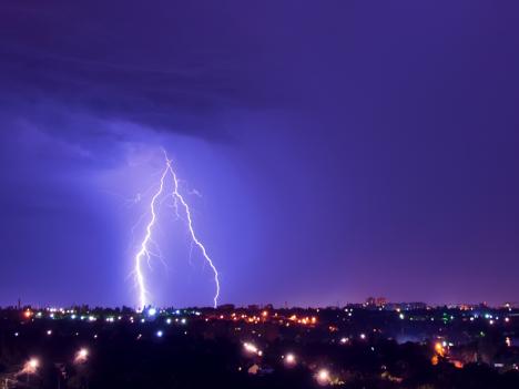 Cloud-to-Ground Lightning Over City