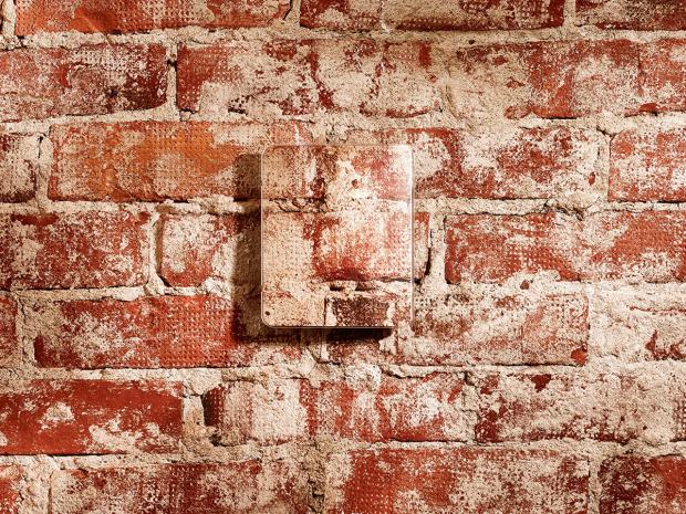 Example of a decorative cover for GMW90 and HMW90 on a brick wall