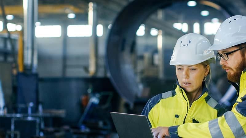woman and man in hard hats