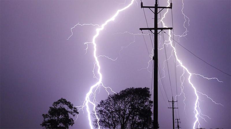 Lightning over power lines