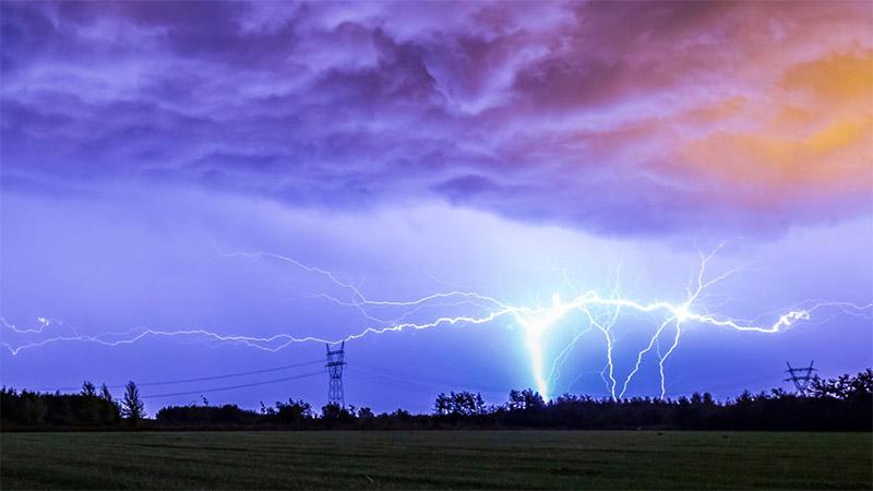 Lightning over power lines