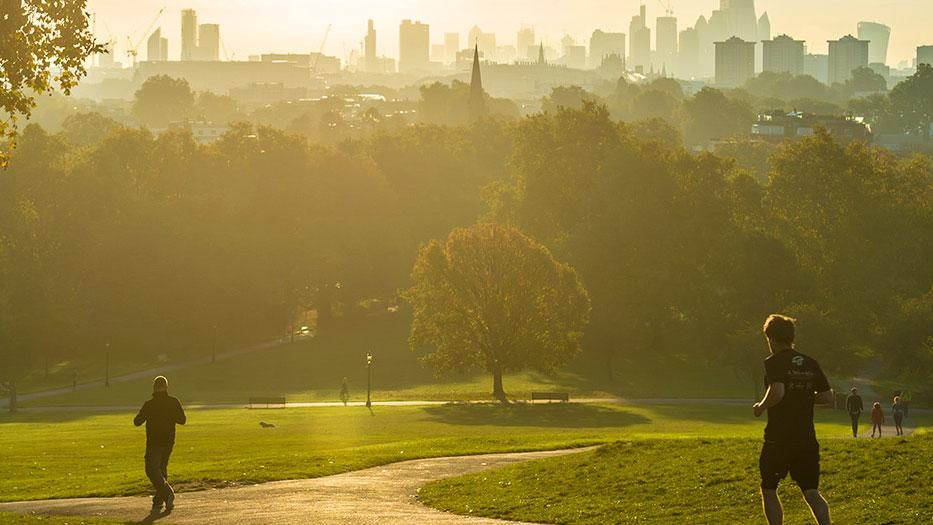 People running in a city park