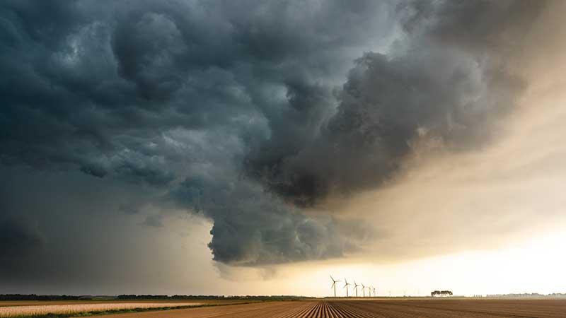 Dark clouds over a field
