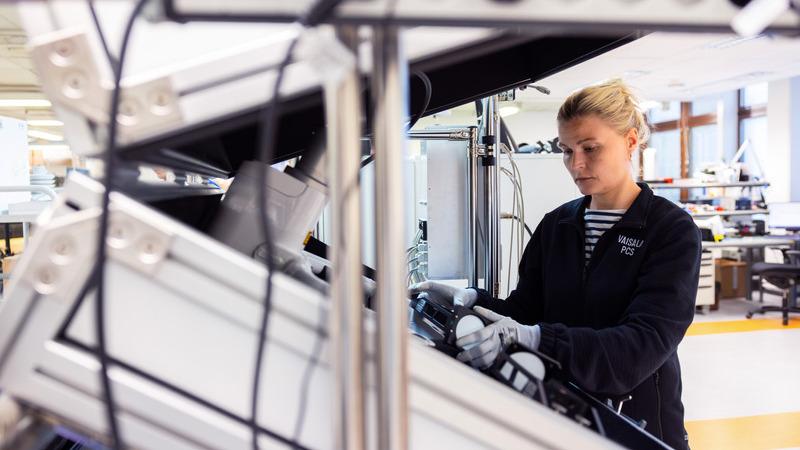 Vaisala employee testing FD70 product in Vaisala service center