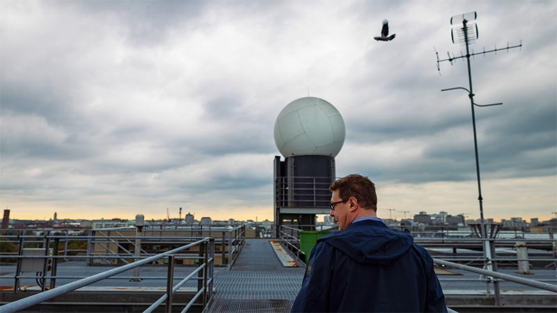 Timo on the roof next to weather radar