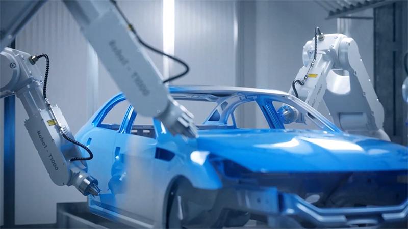 Robot arms painting a car