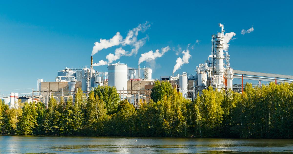 Modern pulp mill in Finland with chimneys and process buildings