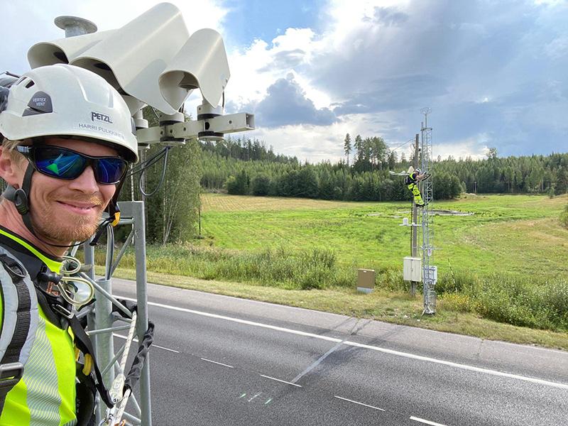 RWS200 installed by the side of the road with technician in front.