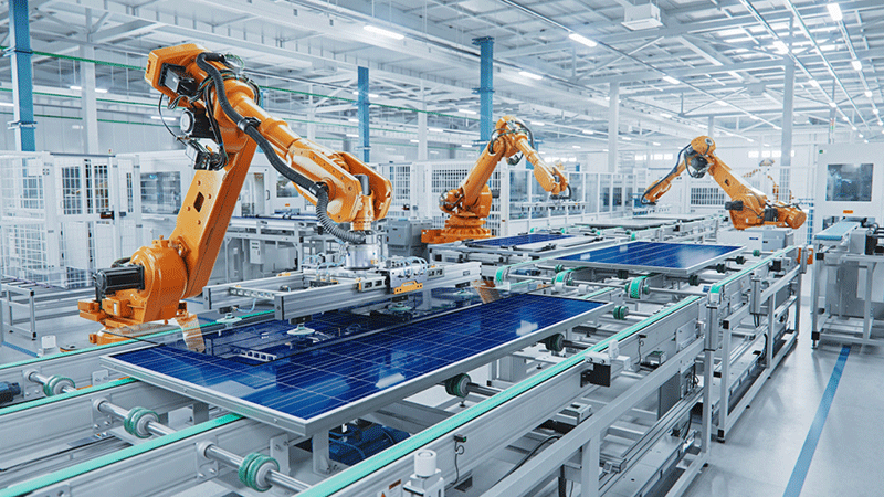 Solar panel production line with industrial robot arms