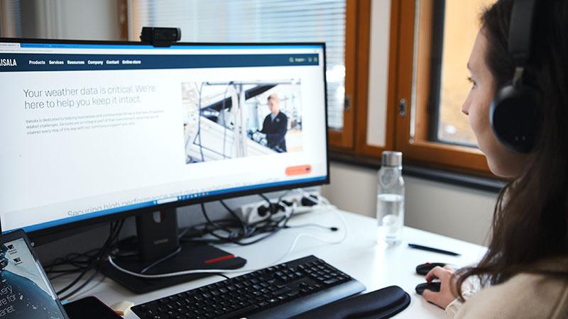 Woman browsing Vaisala website