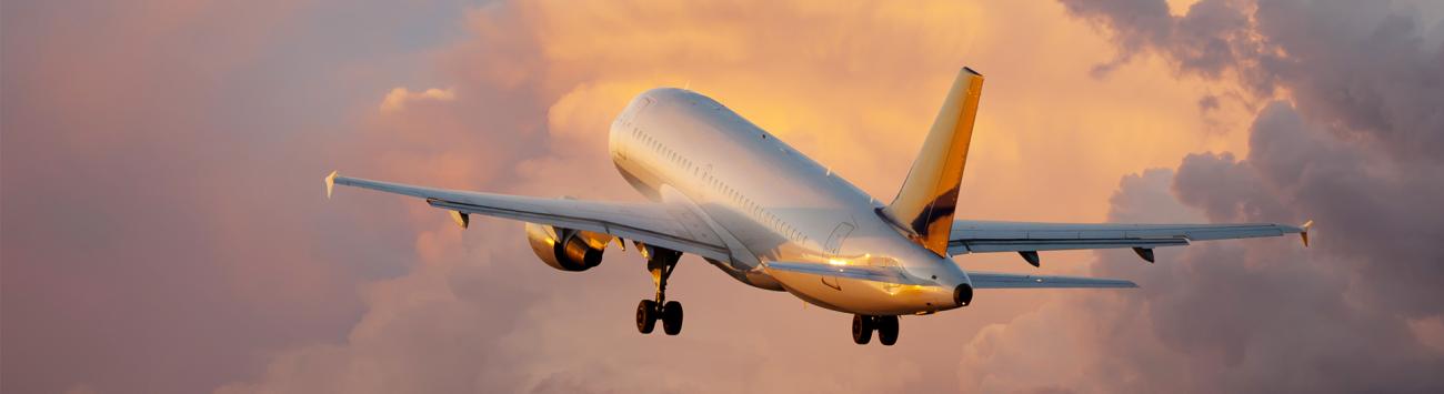 Airplane takeoff in sunset